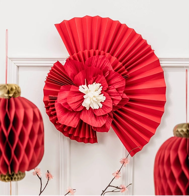red paper fan and flower for backdrop