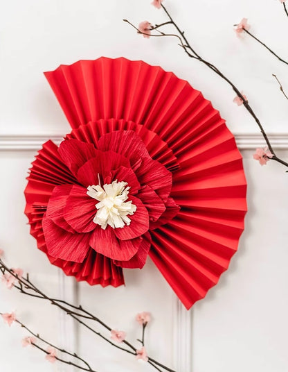 red paper fan and flower for backdrop