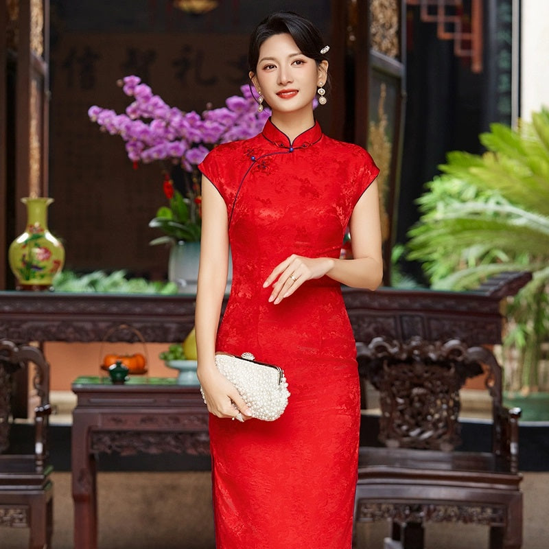 A chinese girl in sleeveless Red Mulberry Silk Floral Jacquard Qipao Dress