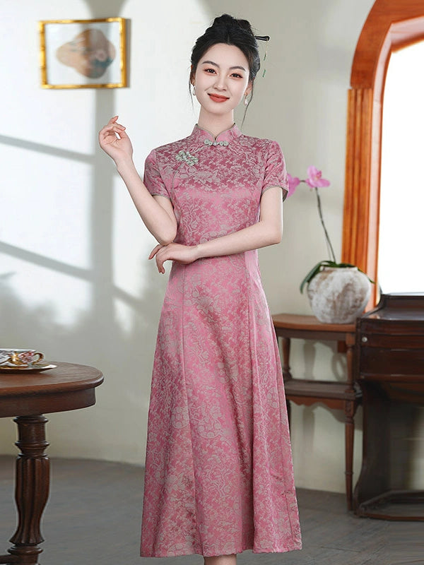 A woman wearing a pink traditional Chinese a line cheongsam dress with floral embroidery, standing in a decorated indoor room with wooden furniture and a window