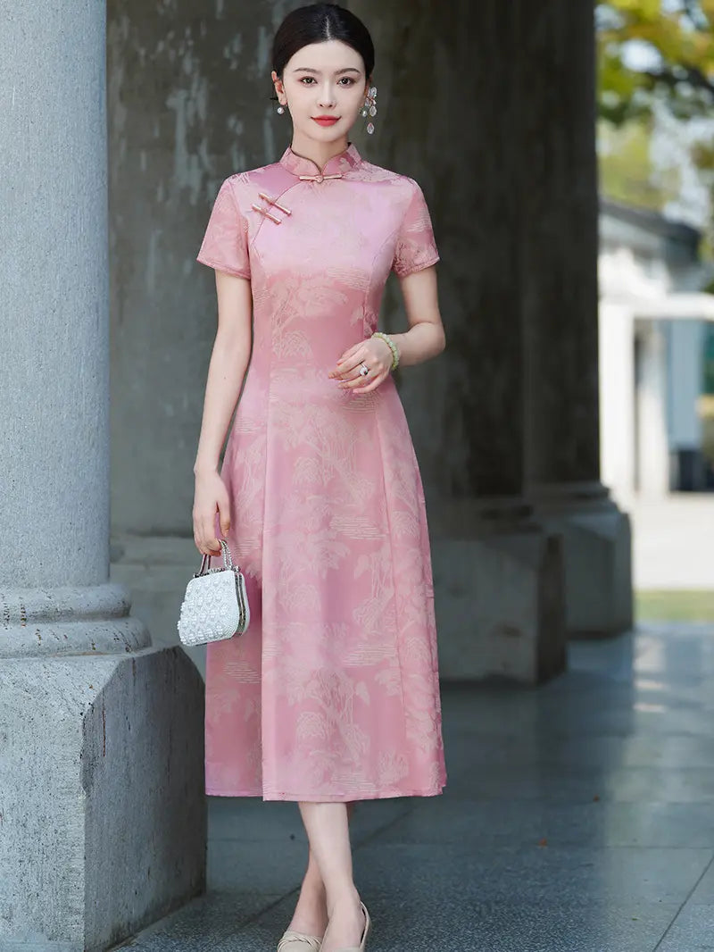 A woman wearing a short-sleeve Rose Pink Landscape Jacquard Modern A Line  midi  Qipao cheongsam dress with a subtle tonal floral pattern, standing outdoors next to a stone column.
