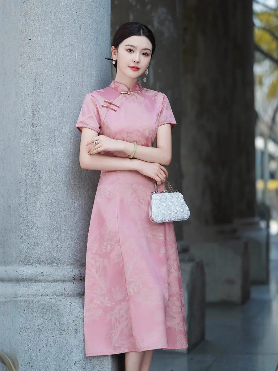 A woman wearing a short-sleeve  Rose Pink Landscape Jacquard Modern A Line Qipao cheongsam dress with a subtle tonal floral pattern, standing against a gray stone column and holding a small white handbag.