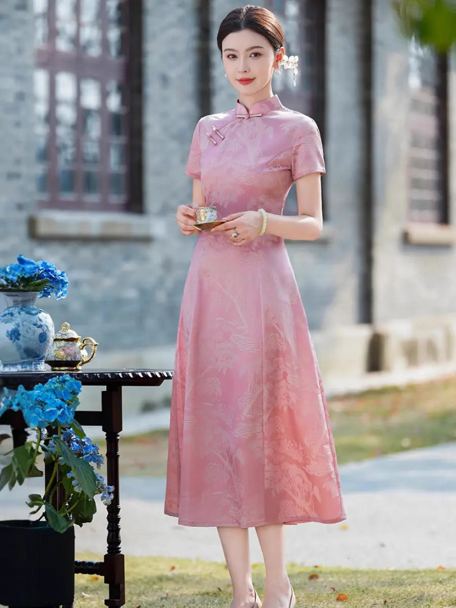 A woman stands outdoors wearing a  short-sleeve Rose Pink Landscape Jacquard Modern A Line Midid= Qipao cheongsam dress with a subtle tonal floral pattern. She is holding a small teacup and saucer next to a table with blue flowers, with a blurred stone building in the background.