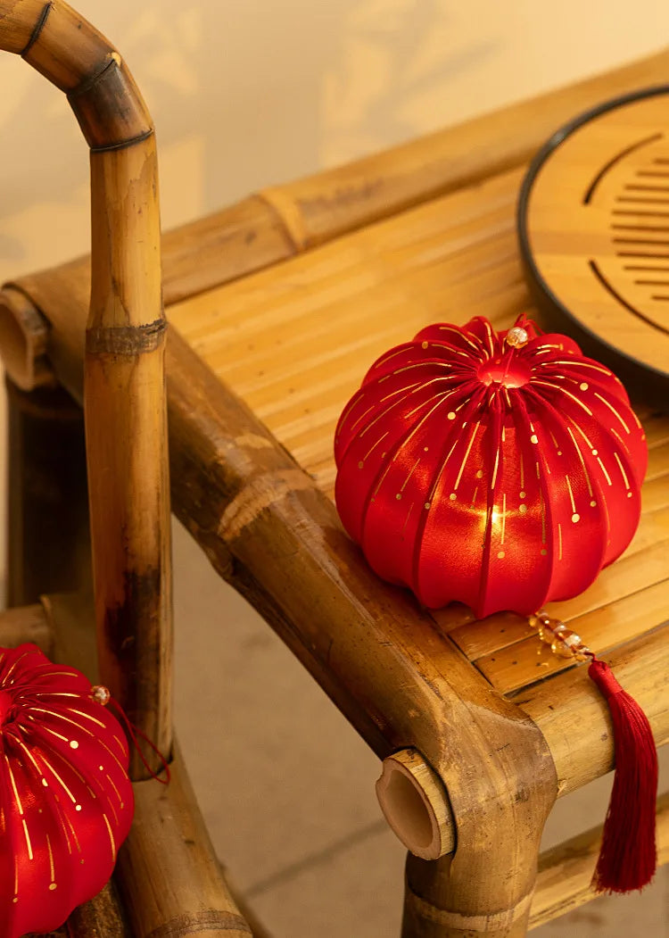 Round Red Fabric Lantern with Light and Tassels for Lunar New Year, Mid-Autumn Festival, weddings, and other celebrations.