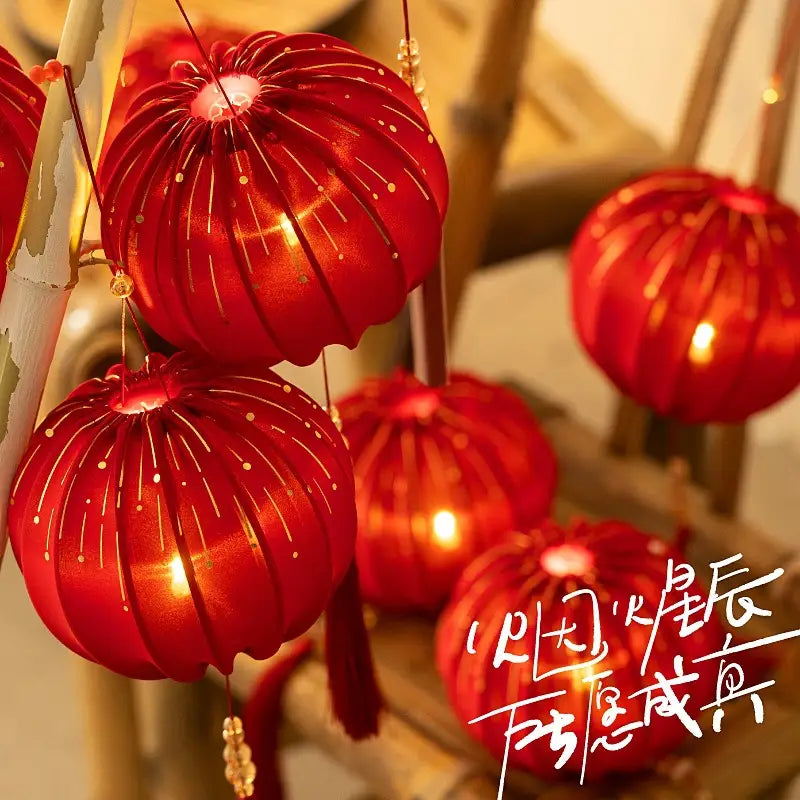 Round Red Fabric Lantern with Light and Tassels for Lunar New Year, Mid-Autumn Festival, weddings, and other celebrations.