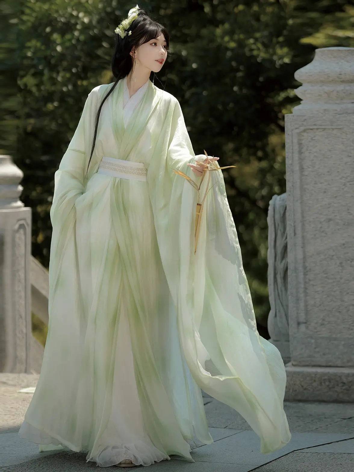 Woman in Sage Green Traditional Wei-Jin Style Double-Layer Hanfu Dress Set  dress standing outdoors with greenery in the background