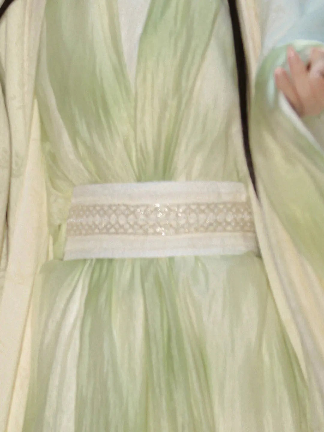 Light green dress with a close-up of the waistband