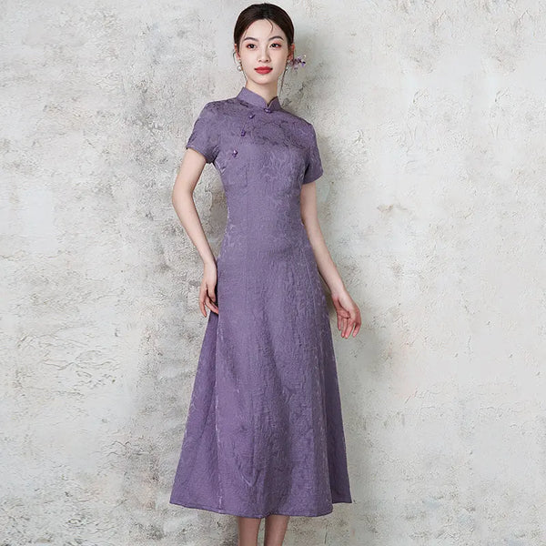 Woman wearing a Purple Short Sleeve Floral A Line Qipao Dress against a textured gray background