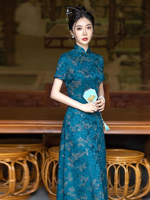 A woman wearing a Teal Blue 3D Textured Floral Jacquard A-Line Qipao  cheongsam dress stands in a traditional indoor setting with wooden furniture. She is holding a light blue fan with a tassel.