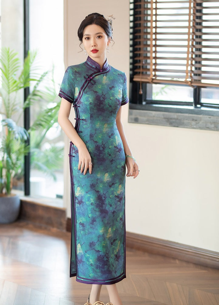 A chinese girl in  teal, blue, and purple foral qipao dress standing