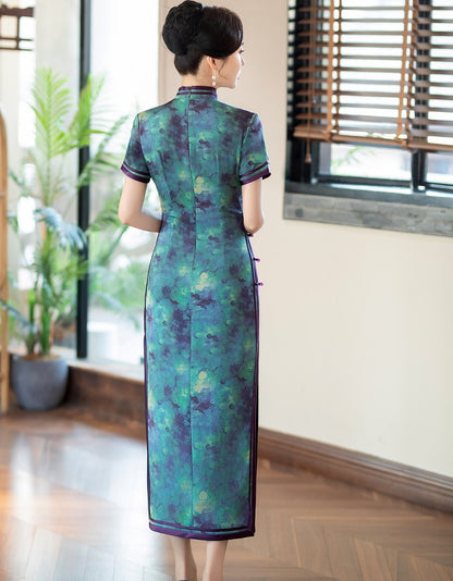 A chinese girl in  teal, blue, and purple foral qipao dress back