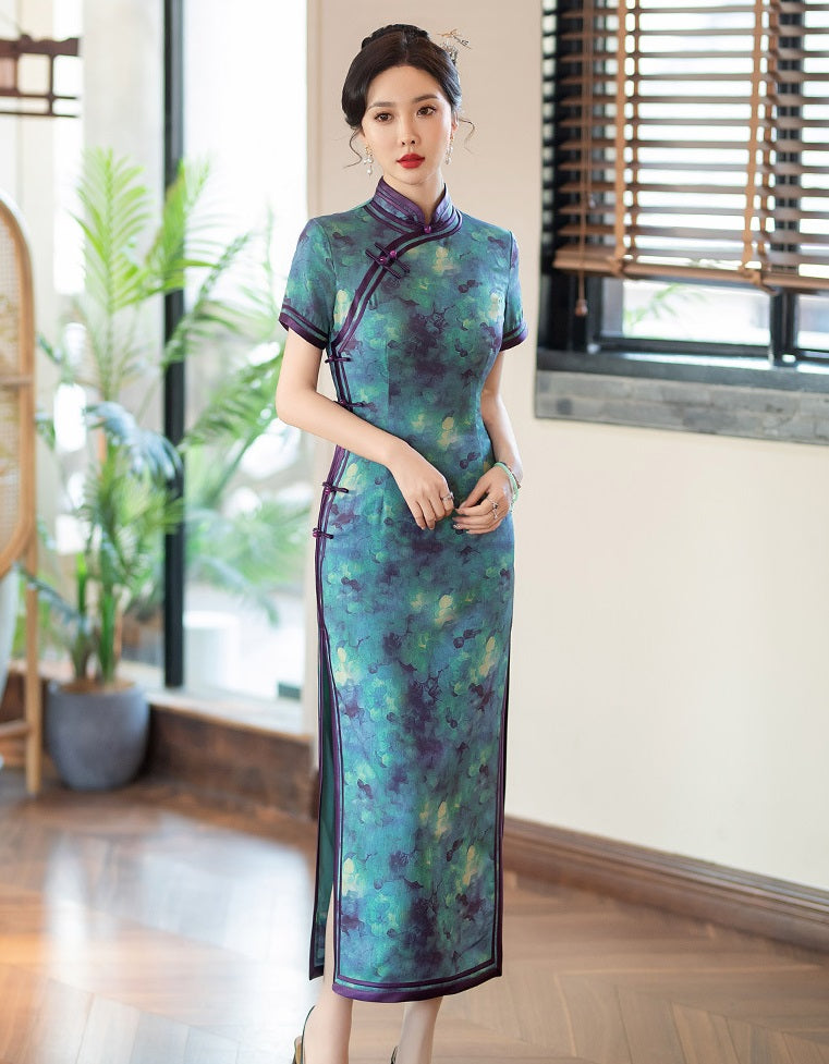 A chinese girl in  teal, blue, and purple foral qipao dress standing