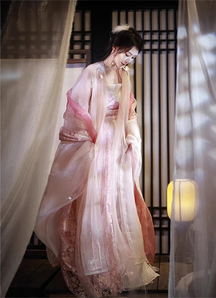 Woman in a Traditional Chinese Clothing - Pink Song Dynasty Hanfu Dress standing in a softly lit room with curtains.