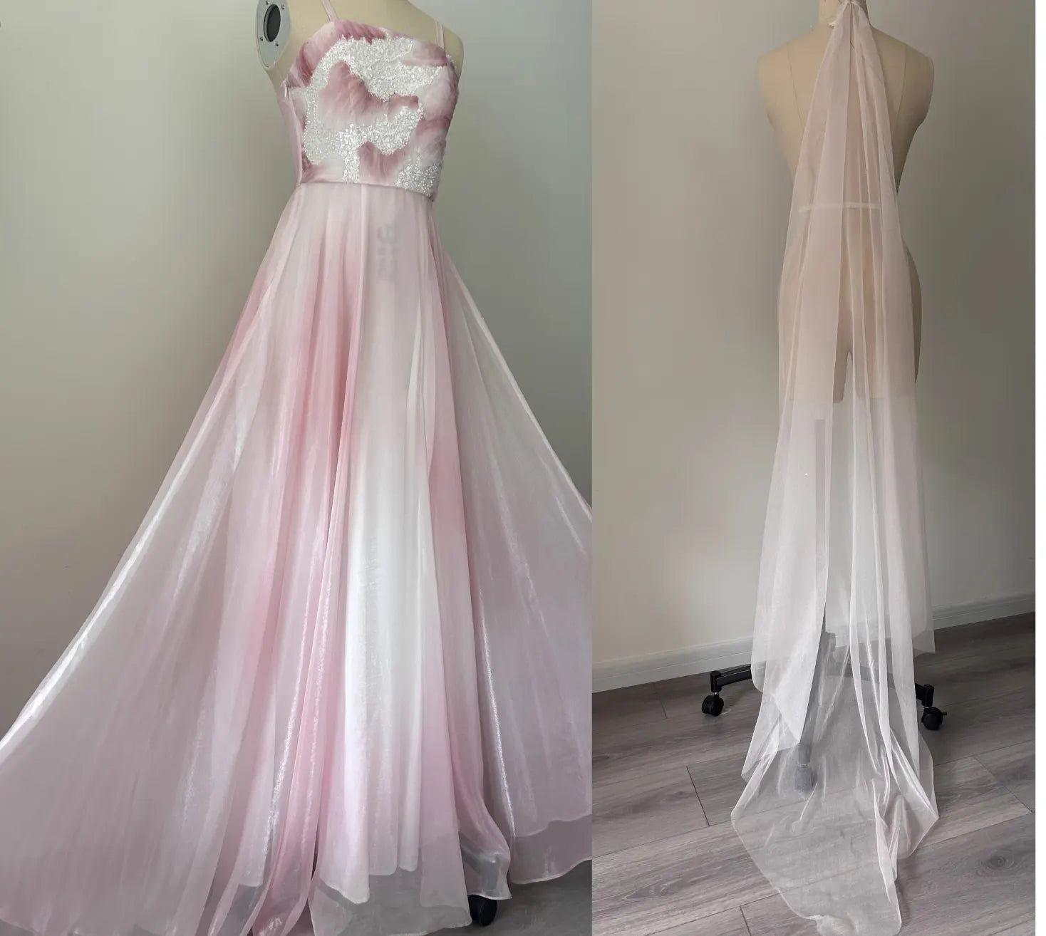 Pink evening gown with lace bodice on a mannequin against a plain background.