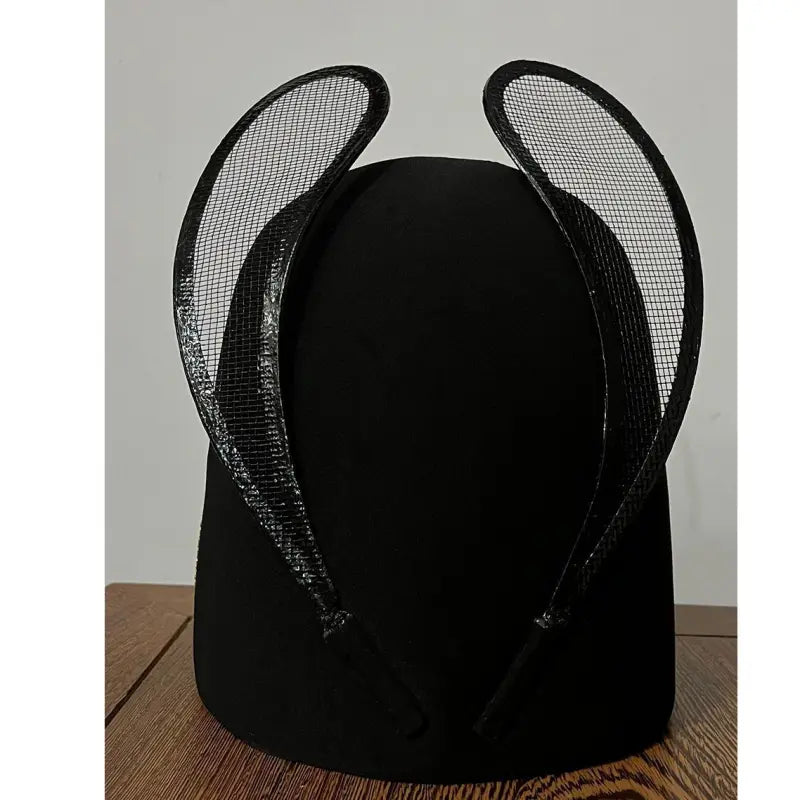 Traditional Chinese Ming Dynasty Black Wusha Hanfu  Hat with mesh wings on a wooden surface