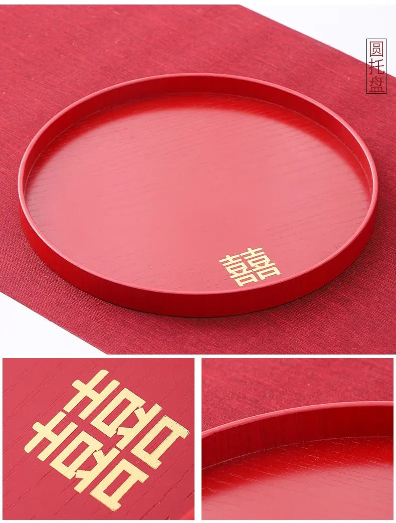 Red round tray with gold Chinese characters on a red background