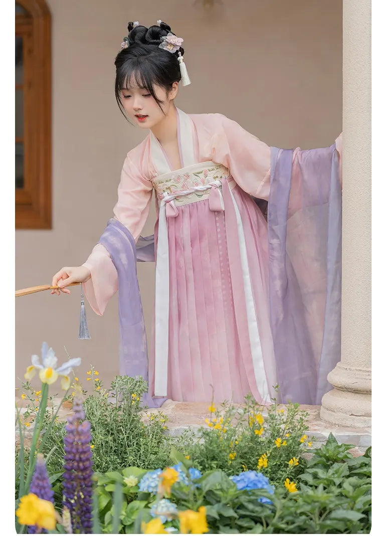Person in Traditional Chinese Tang Dynasty Pink Hanfu Dress Clothing   standing among flowers