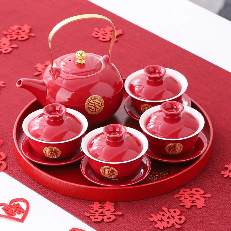 Traditional Chinese Wedding Double Happiness Tea Set on a red tray, surrounded by decorative cutout characters.