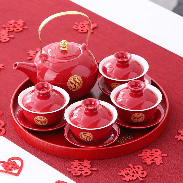 Traditional Chinese Wedding Double Happiness Tea Set on a red tray, surrounded by decorative cutout characters.