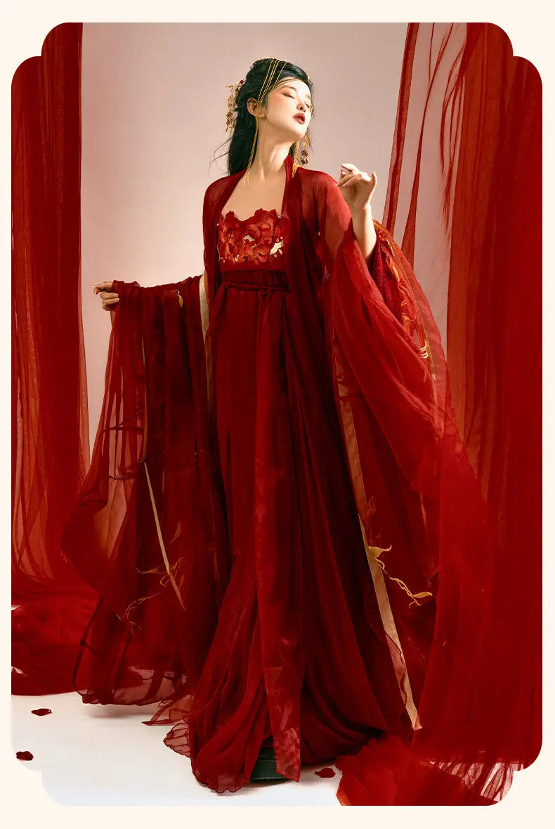 Woman in aTraditonal Chinese Red Embroidered Tang Dynasty Hanfu Set  with a sheer overlay against a red curtain background