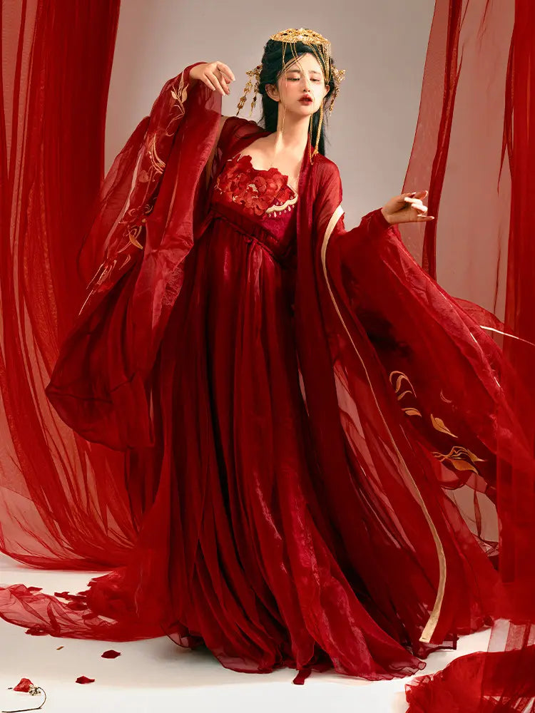Woman in aTraditonal Chinese Red Embroidered Tang Dynasty Hanfu Set  with floral patterns against a red curtain backdrop
