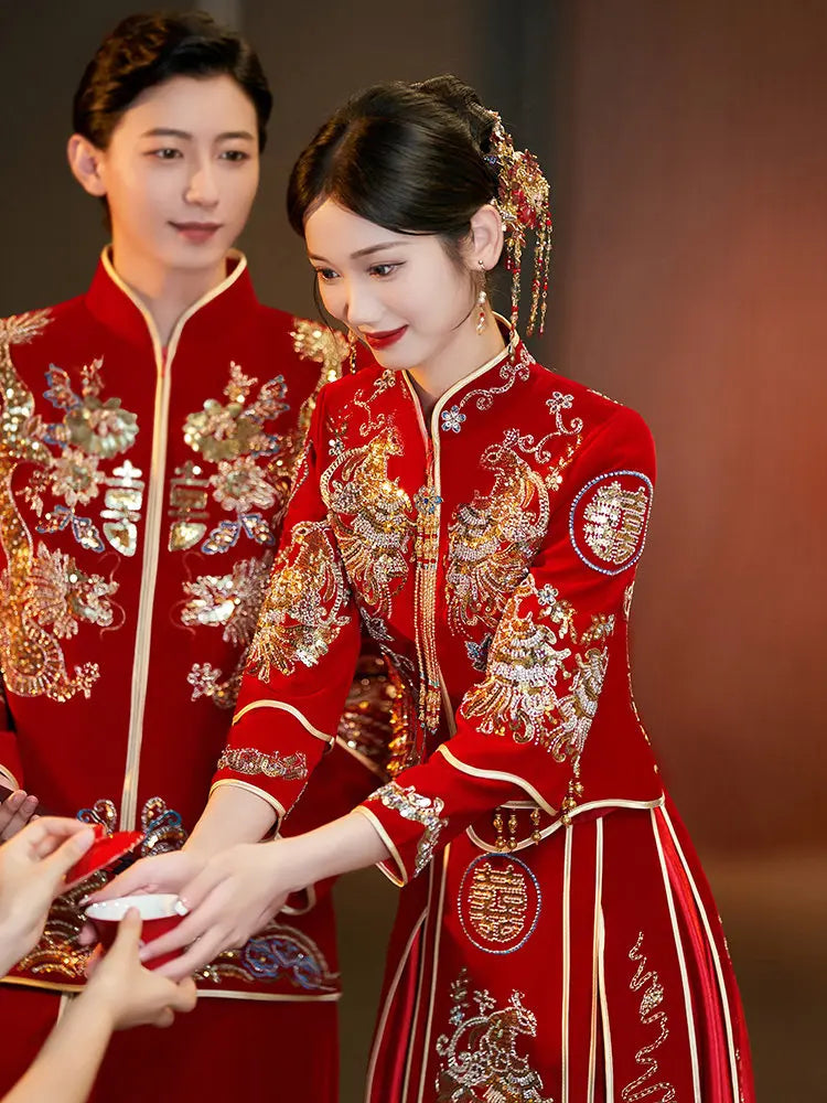 groom and bride in Traditonal Chinese Wedding Phoenix & Dragon Qun Kwa Couple Suite interacting with each other.