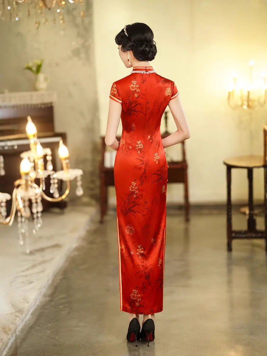 Woman wearing a Vintage Foral Red Silk Qipao Cheongsam Dress in an elegant room with chandeliers.