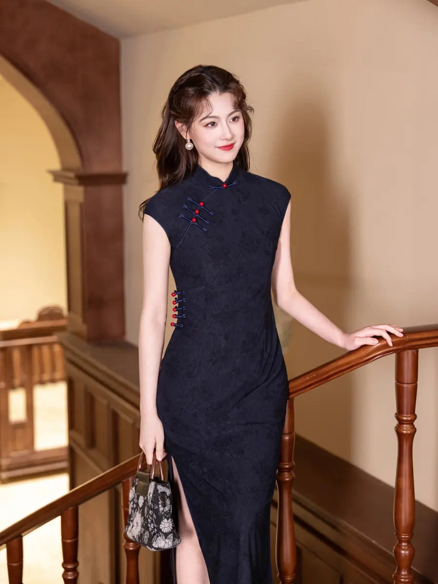 Woman in a dark Vintage Navy Blue Jacquard  Sleeveless cheongsam Qipao Dress With Red Buttons  standing in an indoor setting with wooden railings.