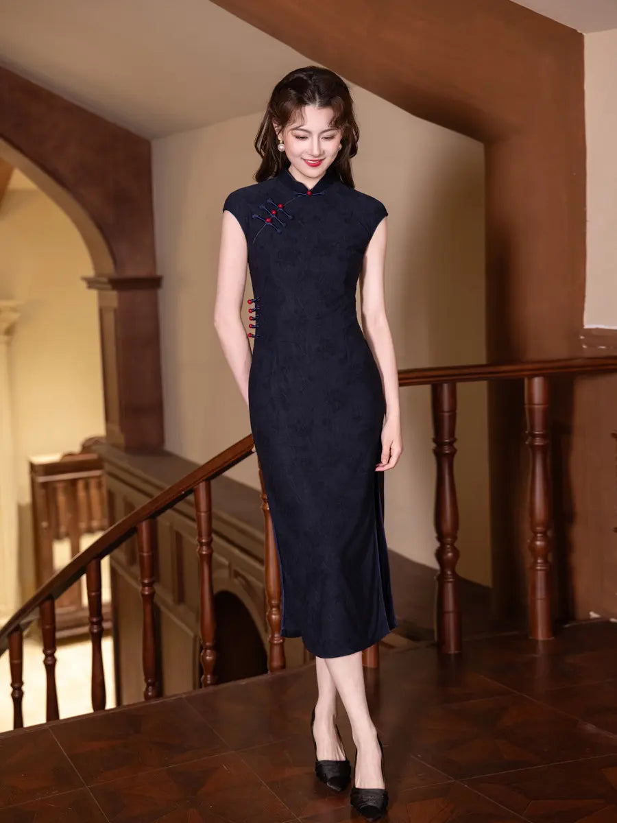 Woman in a dark Vintage Navy Blue Jacquard  Sleeveless Qipao Dress With Red Buttons  standing in an elegant interior setting with wooden staircase.
