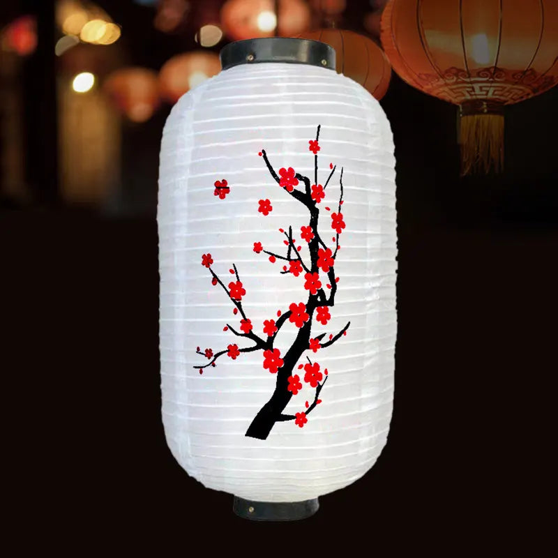 Decorative chinese lantern with cherry blossom design on a dark background
