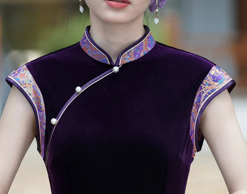 Purple traditional chinese outfit with floral patterns on a blurred background