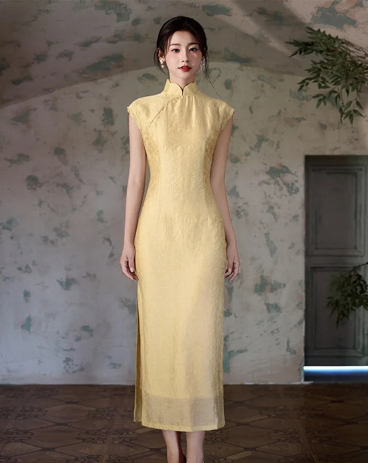 Woman wearing a Yellow Floral Sleeveless Midi Cheongsam Qipao Dress standing in a room with floral wallpaper.