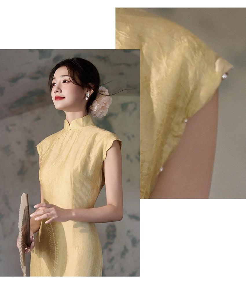 Woman wearing a yellow traditional Floral Sleeveless Midi Cheongsam Qipao Dress  with a close-up of the fabric texture.