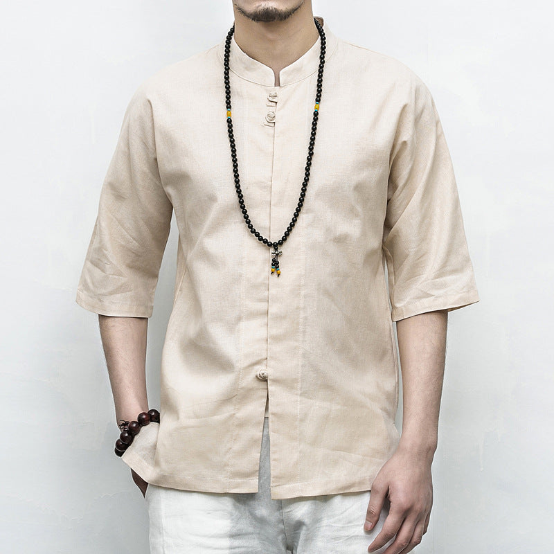 Person wearing a beige Men’s Linen Cotton Chinese Mandarin Collar Shirt with a long necklace against a white background
