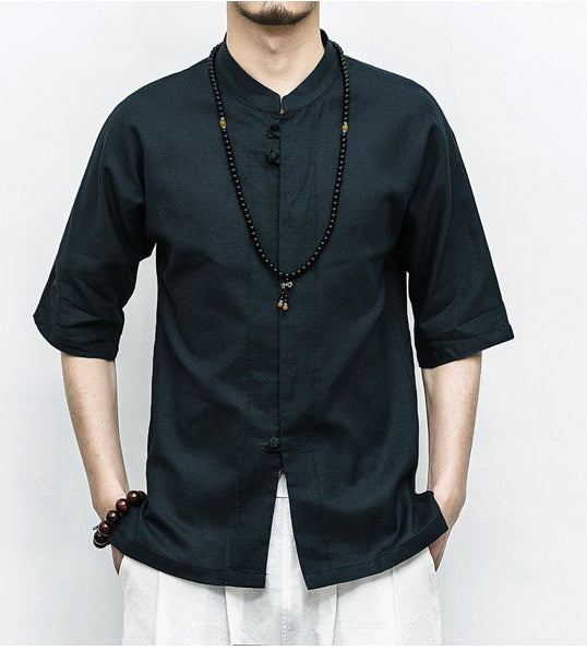 Person wearing a black traditional Men’s Linen Cotton Chinese Mandarin Collar Shirt  with a white background