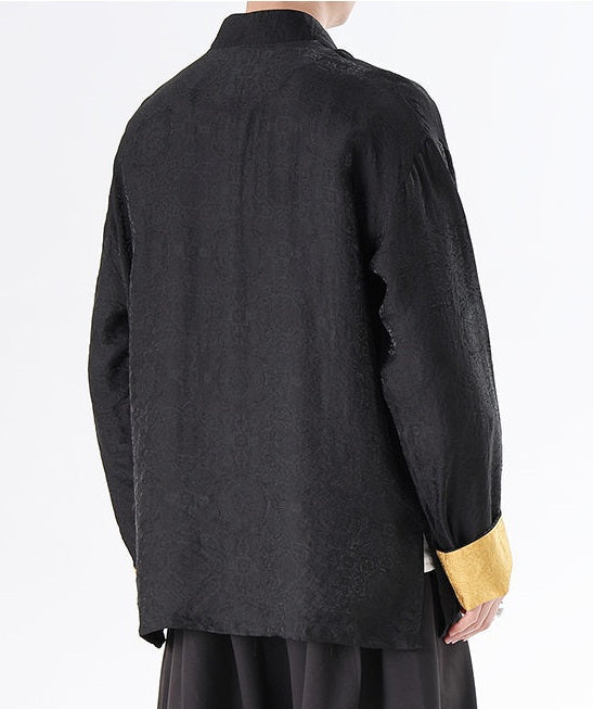 Person wearing a black textured Men's Oriental Jacquard Kung Fu Tang Shirt with a white background