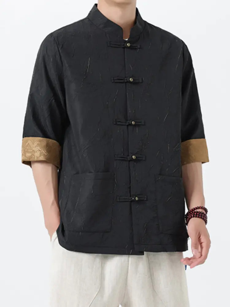 Black traditional Men's Retro Crinkle Texture Half Sleeve Tang Suit Summer Shirtwith gold cuffs on a white background
