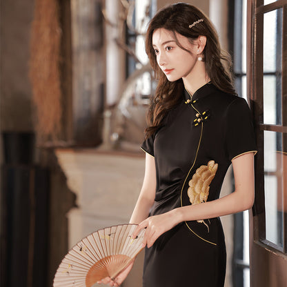  girl with paper hand fan and in black modern qipao dress. Featuring a peony flower embroidery on the waist , traditional mandarin collar, front side side slit 