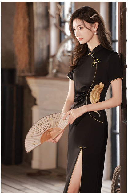  girl in black modern qipao dress. Featuring a peony flower embroidery on the waist , traditional mandarin collar, front side side slit