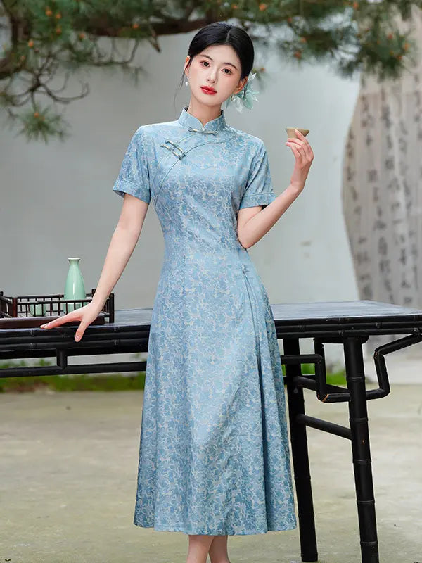 Woman in a light blue traditional Modern Floral Short Sleeve A-Line cheongsam Qipao Dress standing outdoors with a blurred background