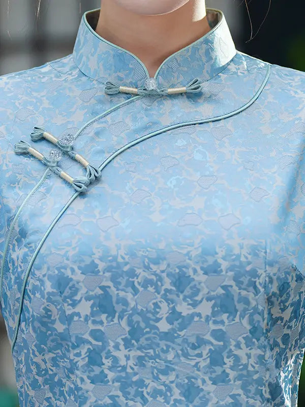 Light blue Modern Floral Short Sleeve A-Line Qipao Dress  on a mannequin with a blurred background