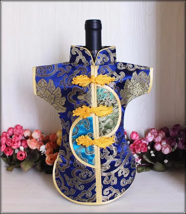 Decorative blue Traditional Chinese Tang Suit Brocade Wine Bottle Cover  with intricate patterns on a white background