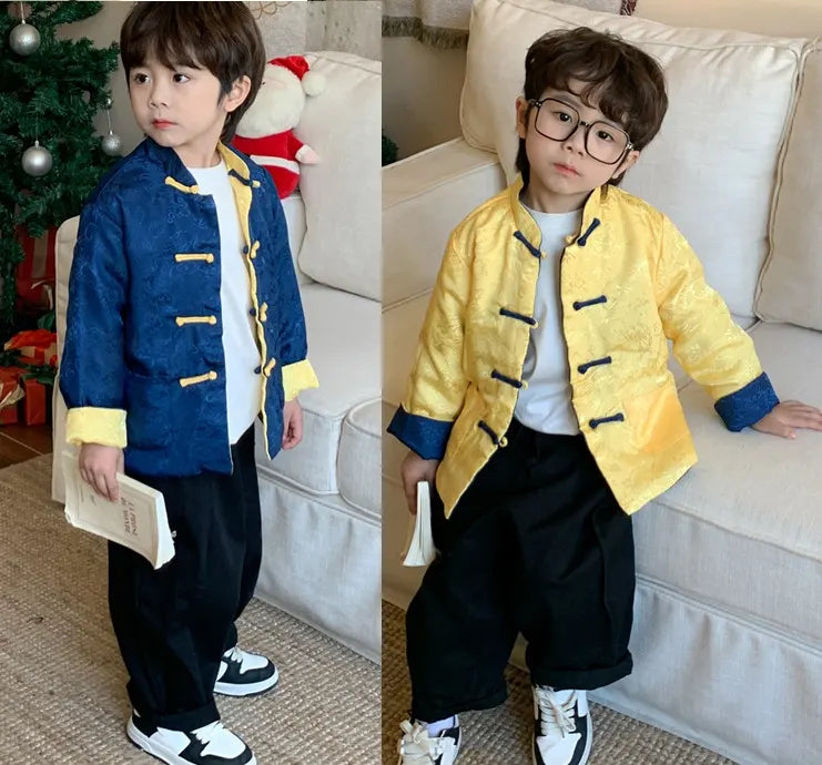 Two images of a child wearing blue yellow Traditional Chinese Kid's Reversible Tang Jacket indoors.