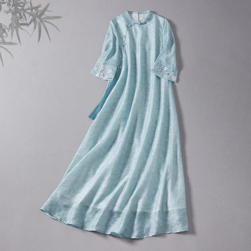 Light blue Loose A line Cheongsam Qipao Dress  with floral embroidery on a gray background