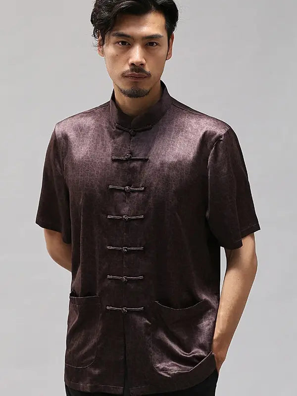 Man wearing a dark brown traditional Chinese Men's Luxury Mulberry Silk Jacquard Short Sleeve Tang Shirt  against a gray background