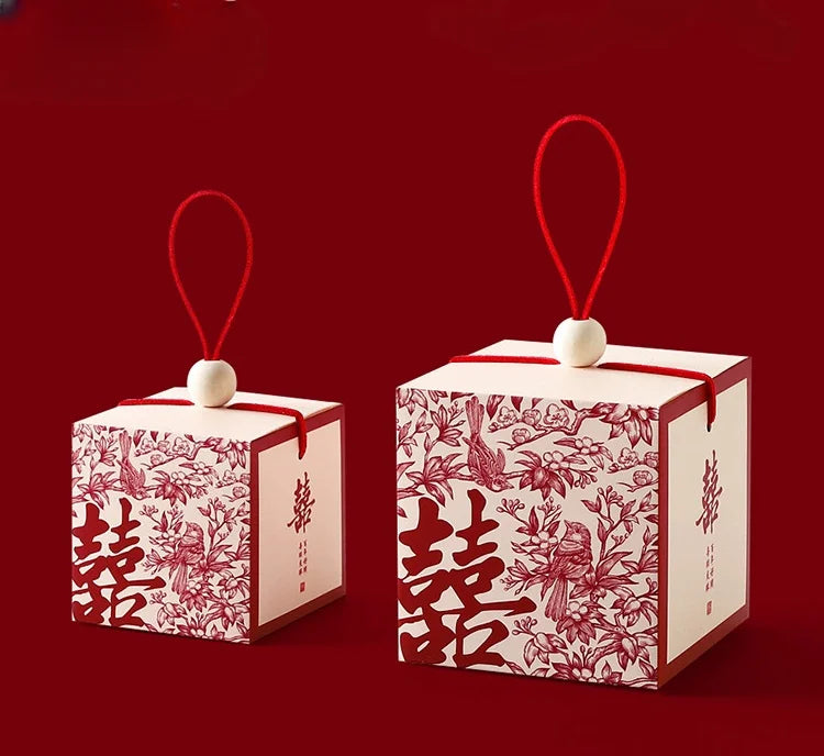 Chinese wedding favor boxes with red double happiness symbol, flowers and pair of birds 