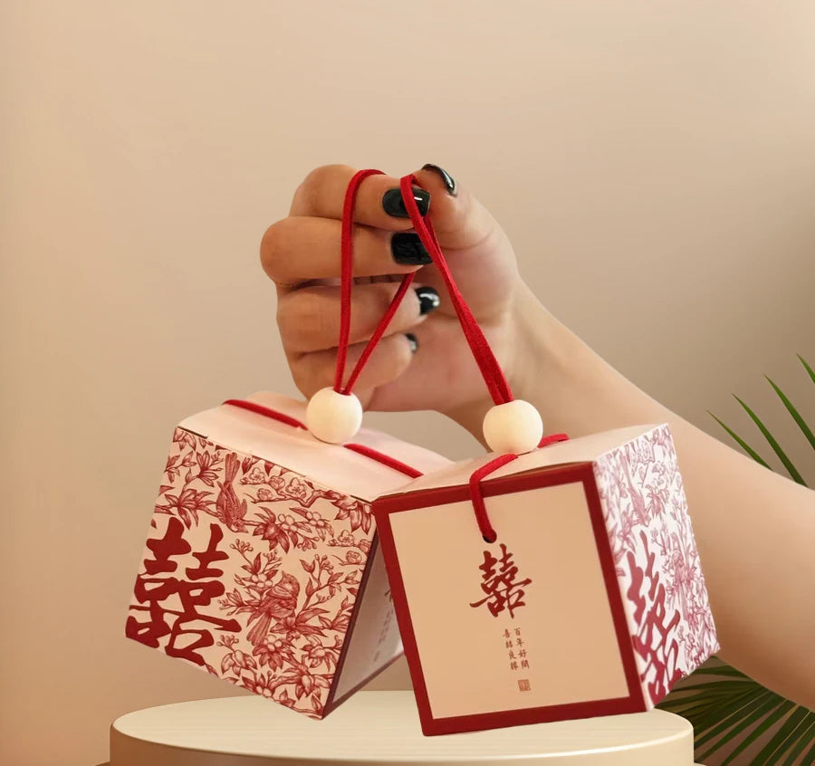 Chinese wedding favor boxes with red double happiness symbol, flowers and pair of birds 
