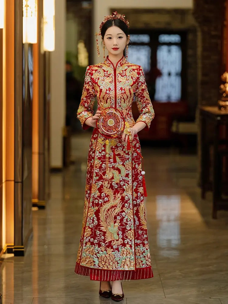 Full-length Qun gua set with detailed dragon and phoenix patterns in red and gold silk.