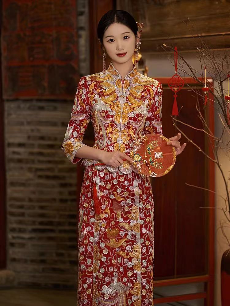 a chinese girl in red and gold traditional chinese wedding dragon pheonix qun kwa dress