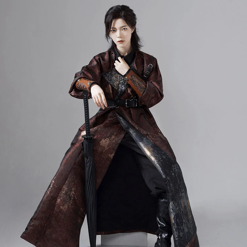 a man in a Chinese Reversible Hanfu Robe  holding a sword against a gray background